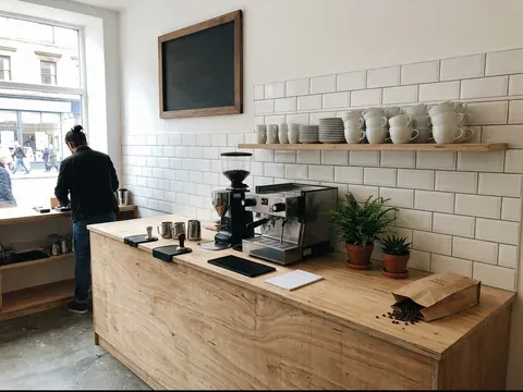 The plywood counter, plants and grinder at Tannahill's
