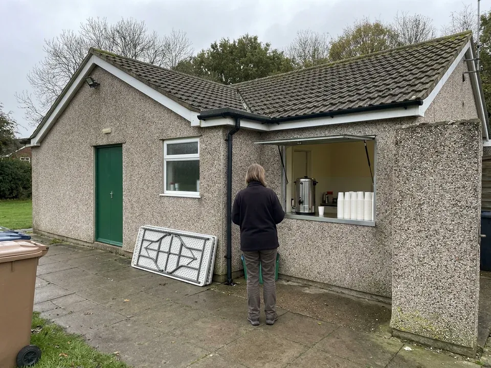 The club's pebbledash clubhouse with the tea hatch open