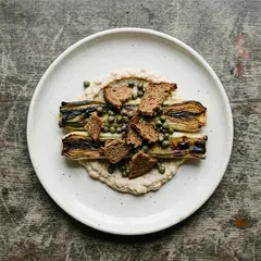 Charred leek as it is plated at Bar Marta