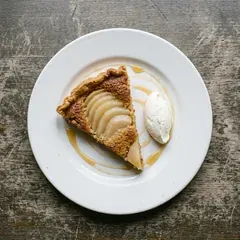 Pear and almond tart as it is plated at Bar Marta